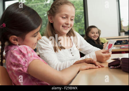 schoolgirl showing a love letter to her classmate, Munich, Bavaria, Germany Stock Photo