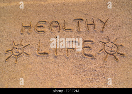 In the picture the words on the sand 'Healty life'. Stock Photo