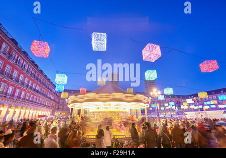 Carousel at Christmas market in Plaza Mayor. Madrid, Spain. Stock Photo