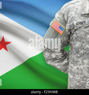 American soldier with flag on background series - Djibouti Stock Photo