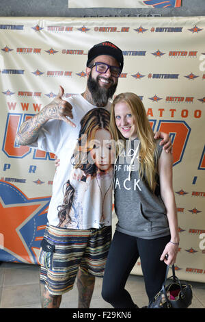 Garden City, New York, USA. 13th Sep, 2015. Mark and a young woman pose at the Instagram photo booth at the United Ink Flight 915 Tattoo convention at the Cradle of Aviation Museum in Long Island. © Ann Parry/ZUMA Wire/Alamy Live News