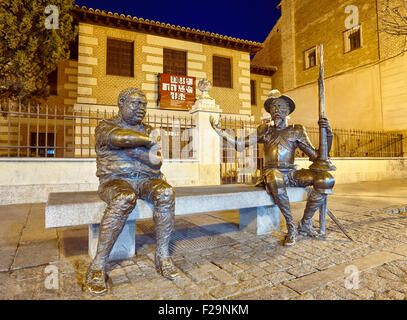 Don Quixote and Sancho Panza sculpture at the entrance to Cervantes Birthplace Museum, Alcala de Henares. Calle Mayor street, Al Stock Photo