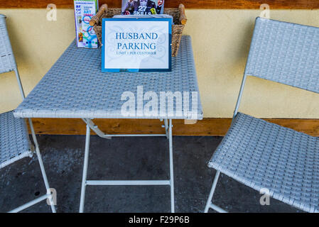 Husband Parking sign outside gift shop Stock Photo