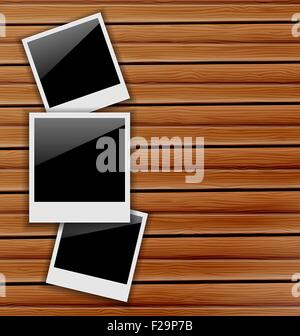 Three blank photo frames on wooden background Stock Vector