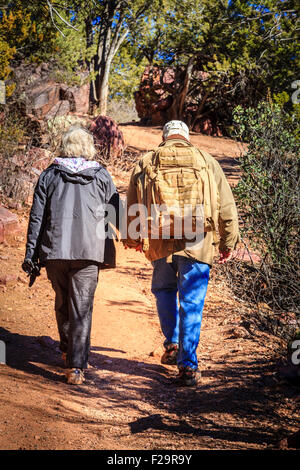 Senior couple is hiking on a trail in Tonto Bridge State Park in Arizona Stock Photo