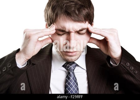 Tired stressed businessman having a big headache Stock Photo