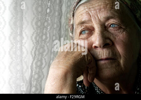 Elder senior woman with sad face suffering from depression Stock Photo