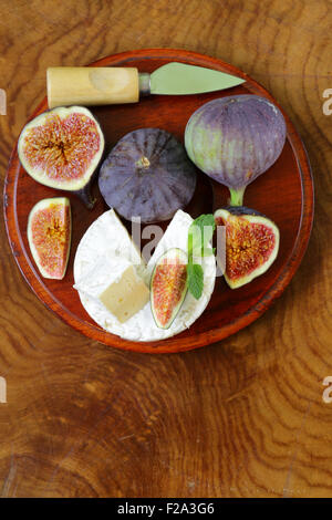 Cheese with white mold (Camembert, Brie) with fresh figs Stock Photo