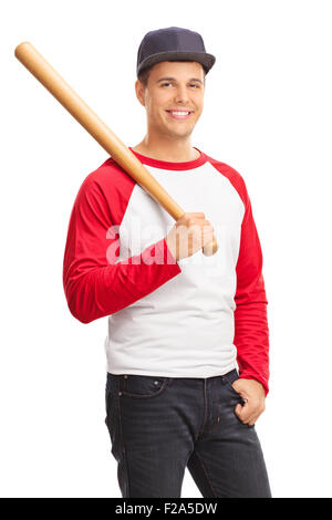 Vertical shot of a young male baseball player holding a baseball bat and looking at the camera isolated on white background Stock Photo