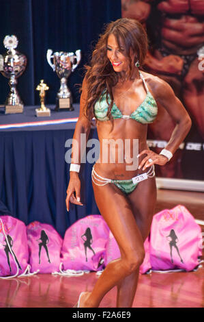 SCHIEDAM, THE NETHERLANDS - APRIL 26, 2015: Female bikini model shows her best on stage Stock Photo