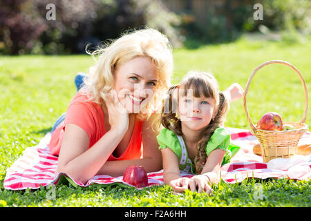 happy family relaxing on a meadow Stock Photo