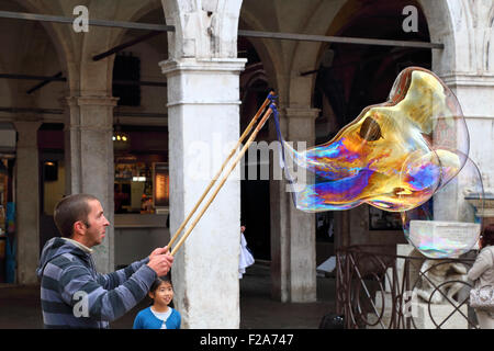Soap bubble street artist performance in Venice Stock Photo