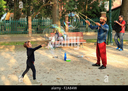 Soap bubble street artist performance in Venice Stock Photo