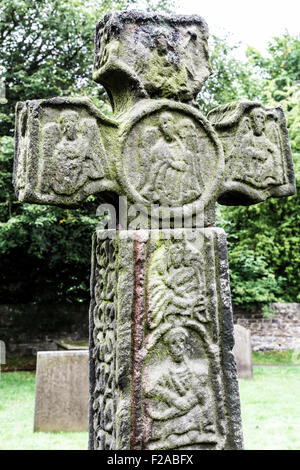 Celtic Cross 8th Century AD in Eyam parish church, Derbyshire Dales Peaks District, England- Stock Photo