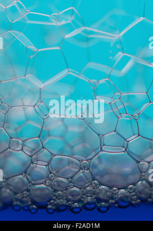 Soap bubbles macro forming hexagonal pattern, vertical image Stock Photo