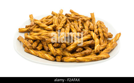 A dish filled with braided pretzel sticks isolated on a white background. Stock Photo
