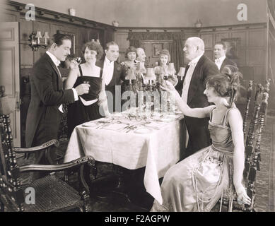 Toasting the host of dinner party (OLVI008 OU064 F) Stock Photo