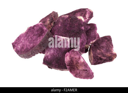 Group of freeze dried apple slices coated with Maqui berry powder isolated on a white background. Stock Photo