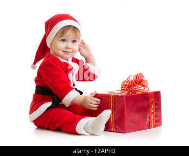 Christmas baby with gift box in Santa's suit isolated Stock Photo