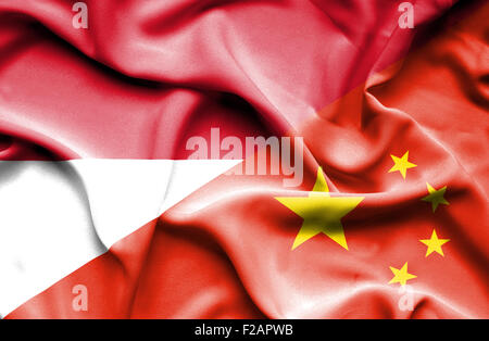 Waving flag of China and Indonesia Stock Photo