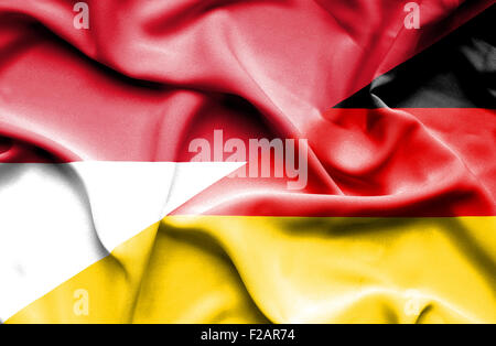 Waving flag of Germany and Indonesia Stock Photo