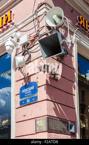 Surveillance cameras and loudspeakers on the corner of the building Stock Photo