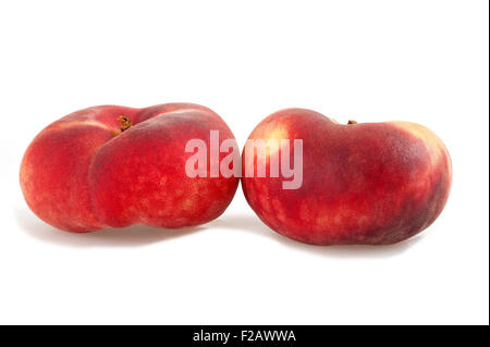 Two saturn peach isolated on white Stock Photo