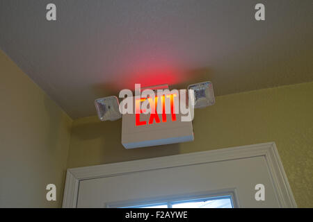 Neon Motel Exit sign over doorway Stock Photo