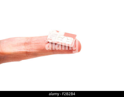SIM card on finger isolated on white Stock Photo
