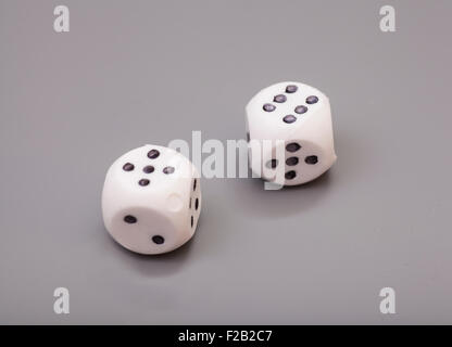 white dices on grey background Stock Photo