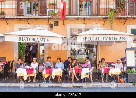 Tourists people watching at a Restaurant in the Piazza Navona Rome Italy Roma lazio Italy EU Europe Stock Photo