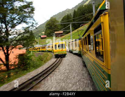 Freight train crossing the alps in Uri Switzerland Stock Photo - Alamy