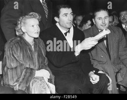 Actor Gregory Peck and his wife, Greta Kukkonen, at the Maxim-Mills title fight. Jan 24, 1950. World Heavyweight holder Freddie Stock Photo