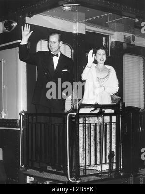 Queen Elizabeth II and Prince Philip wave from the back of a train at Union Station. After entertaining the President Eisenhower and the First Lady, they leave for New York City. Oct. 20, 1957 - (BSLOC 2014 16 217)