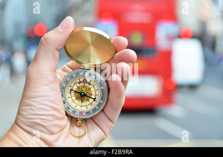 Compass in the hand on a street of London Stock Photo
