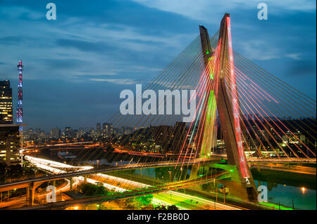 Most famous bridge in the city at dusk, Octavio Frias De Oliveira Bridge, Pinheiros River, Sao Paulo, Brazil Stock Photo
