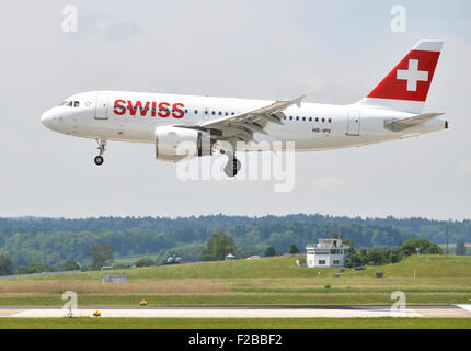 ZURICH, SWITZERLAND - MAY 25, 2014: Swiss airplane landing in Zurich international airport on May 25, 2014. Zurich International Stock Photo