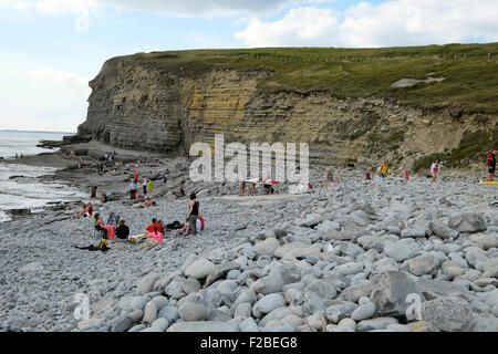 People on the stony beach at Southerndown, Dunraven Bay Wales UK  KATHY DEWITT Stock Photo