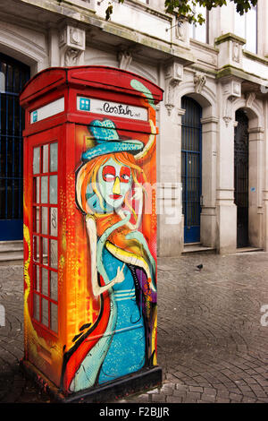 Old style telephone box in Porto painted by street artist Nuno Costah. Stock Photo