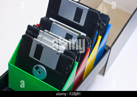Floppy disk in a box container. White background Stock Photo