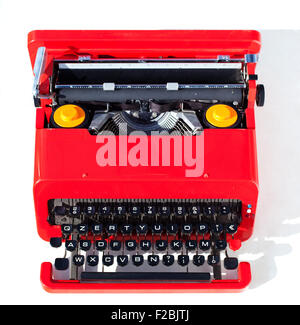 Old red typewriter isolated on a white background Stock Photo