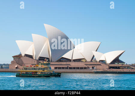 Sydney ferry passes in front of the Sydney Opera House on a sunny spring day ,Australia Stock Photo