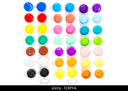 The range of different colors of paint gouache in containers . Stock Photo