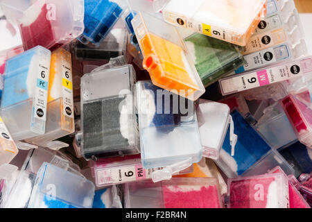 Canon used ink jet plastic cartridges laying scattered in a messy pile. Various coloured inks, all from the BCI 6 series of ink carts. Stock Photo