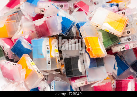 Canon used ink jet plastic cartridges laying scattered in a messy pile. Various coloured inks, all from the BCI 6 series of ink carts. Stock Photo