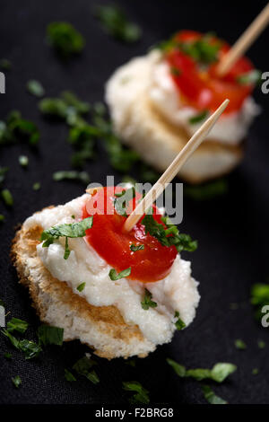 Roe salad appetizer with bread and tomatoes Roe salad appetizer with bread and tomatoes