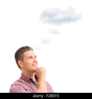 Young pensive man contemplating something with a cloud floating over his head isolated on white background Stock Photo