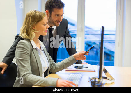 sharing business colleagues discussing project in office Stock Photo