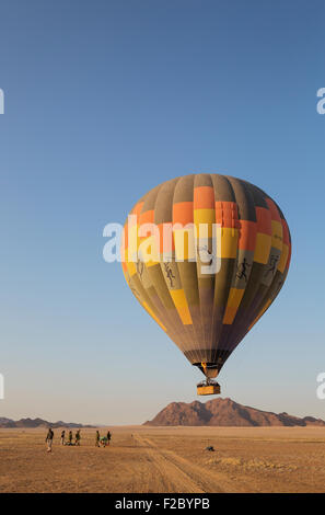 Hot-air balloon just taken-off in the early morning, Namib Desert, Kulala Wilderness Reserve, Namibia Stock Photo