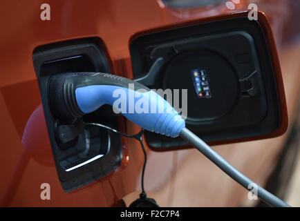 Frankfurt, Germany. 16th Sep, 2015. A recharging cable for electric vehicles has been attached to a BMW i3 at the International Motor Show IAA in Frankfurt/Main, 16 September 2015. Around 1,000 exhibitors from 40 countries will present their latest products at the world's leading motor show, which will run from 17 to 27 September 2015. Credit:  dpa picture alliance/Alamy Live News Stock Photo